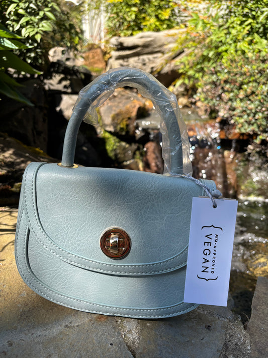 Baby blue colored handbag/shoulderbag with straps inside purse